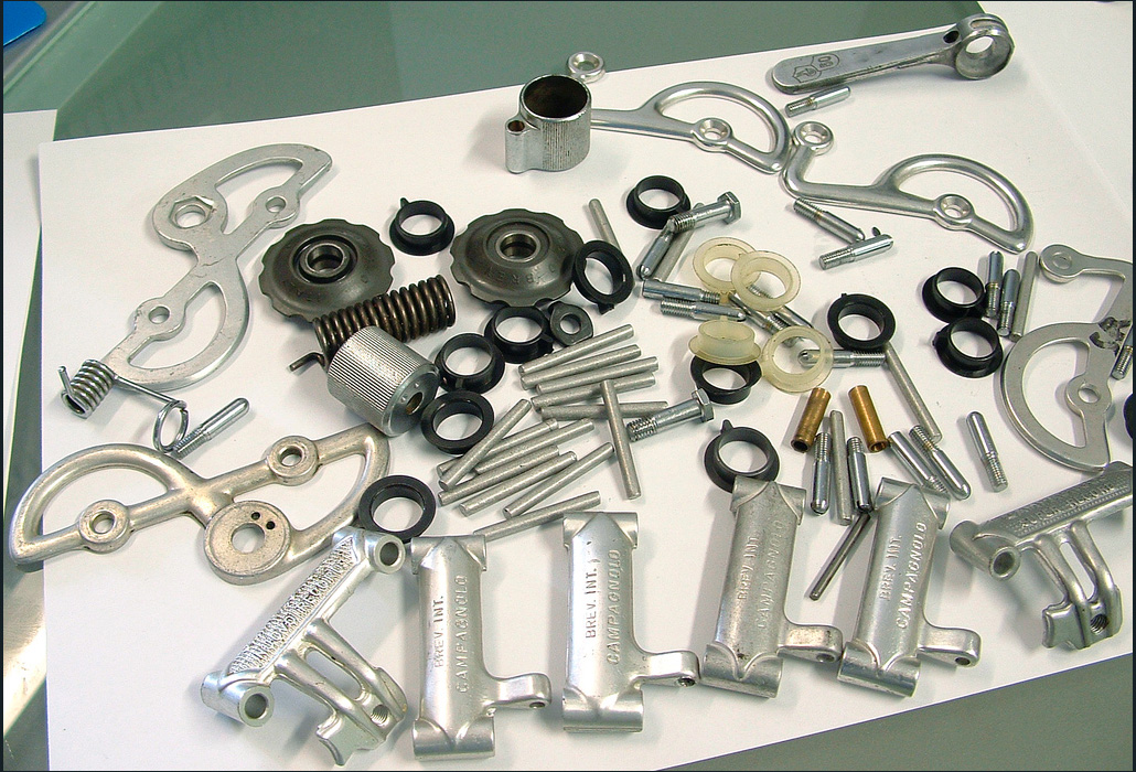 Campagnolo Nuovo Record and Super Record derailleur parts, destined to be assembled in the homes of 1970's Campagnolo workers. These parts were "collected" but never assembled into working frankensteined derailleurs.