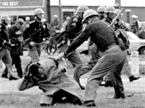 John Lewis being beaten by an Alabama State Trooper at the Edmund Pettus Bridge in Selma, AL