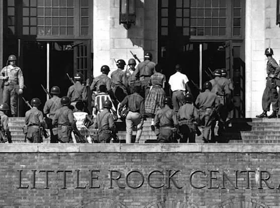 Little Rock Nine Enter Central High School Guarded by Soldiers of the 101st Airborne