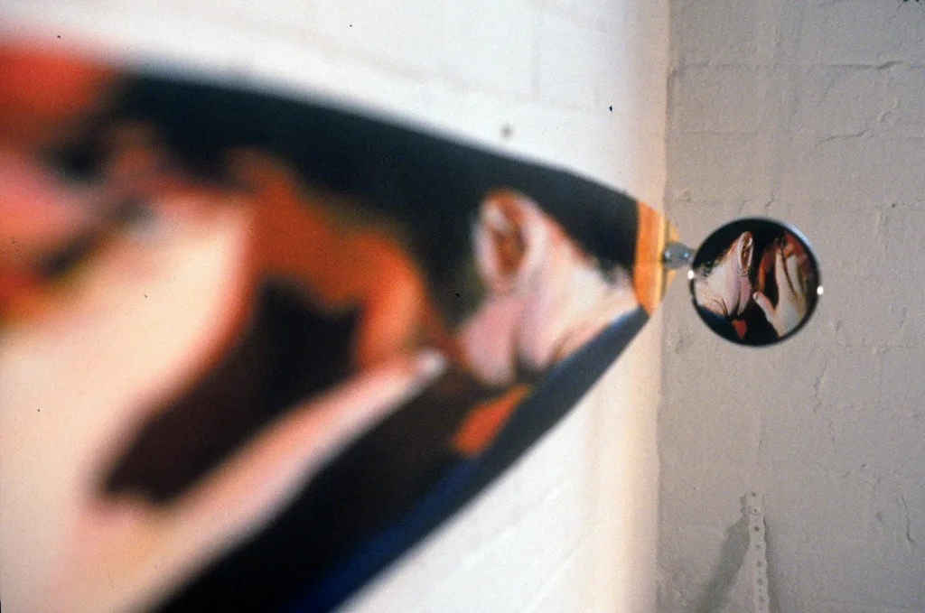 Mike No. 3 (detail), acrylic on wood with car mirror, 2000.