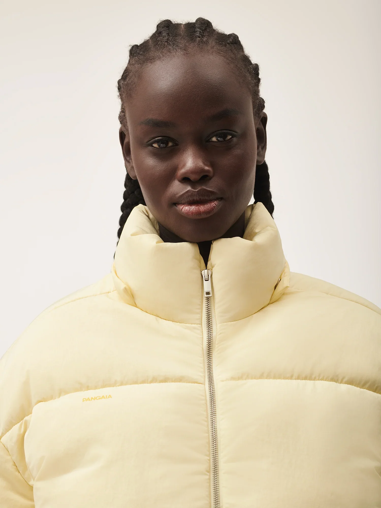 Womens_FLWRDWN_Recycled_Nylon_Cropped_Puffer_Rind_Yellow-4.webp