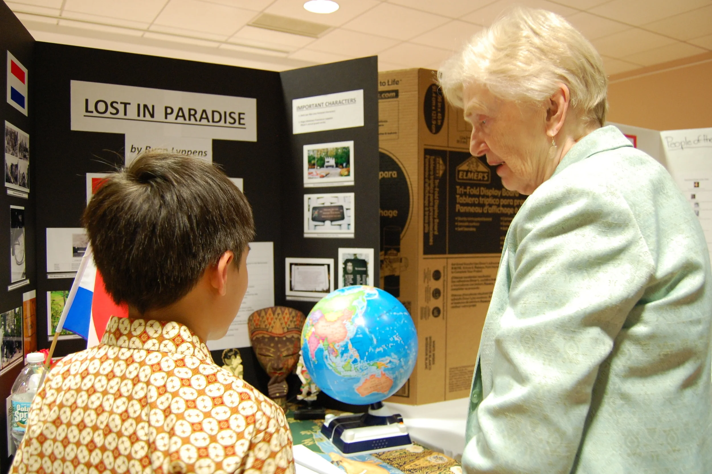 Junior High School Project author discussing work with Kendal resident