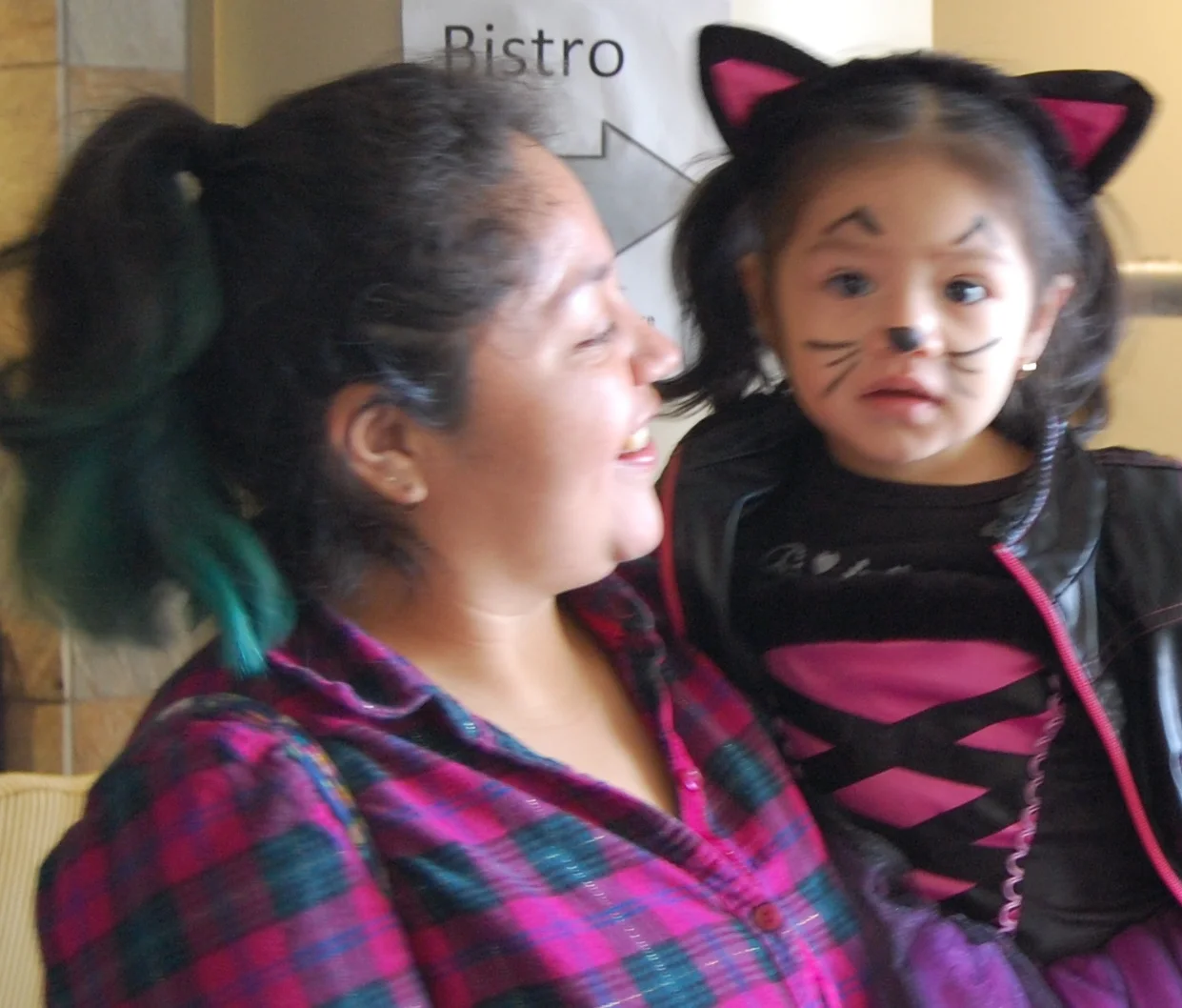 Pre-schooler in Hallowe'en costume and caregiver