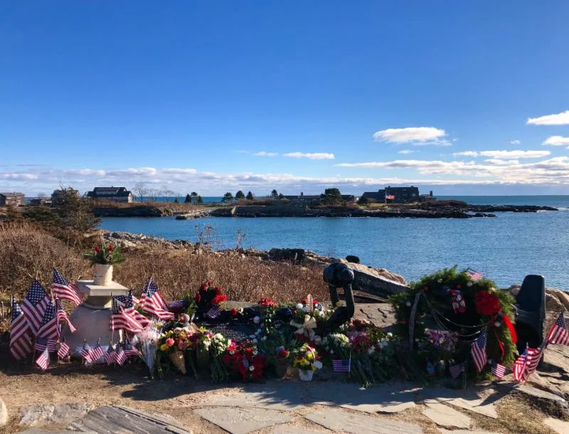 (President Bush always called Walker Point his “Anchor to Windward.” The floral tributes and socks placed here atop the wrought-iron anchor multiply daily.)