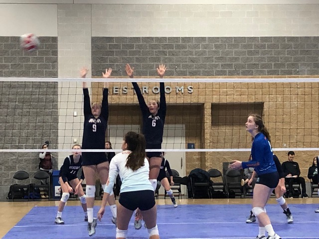 Maddie, No. 9, in action at the net.