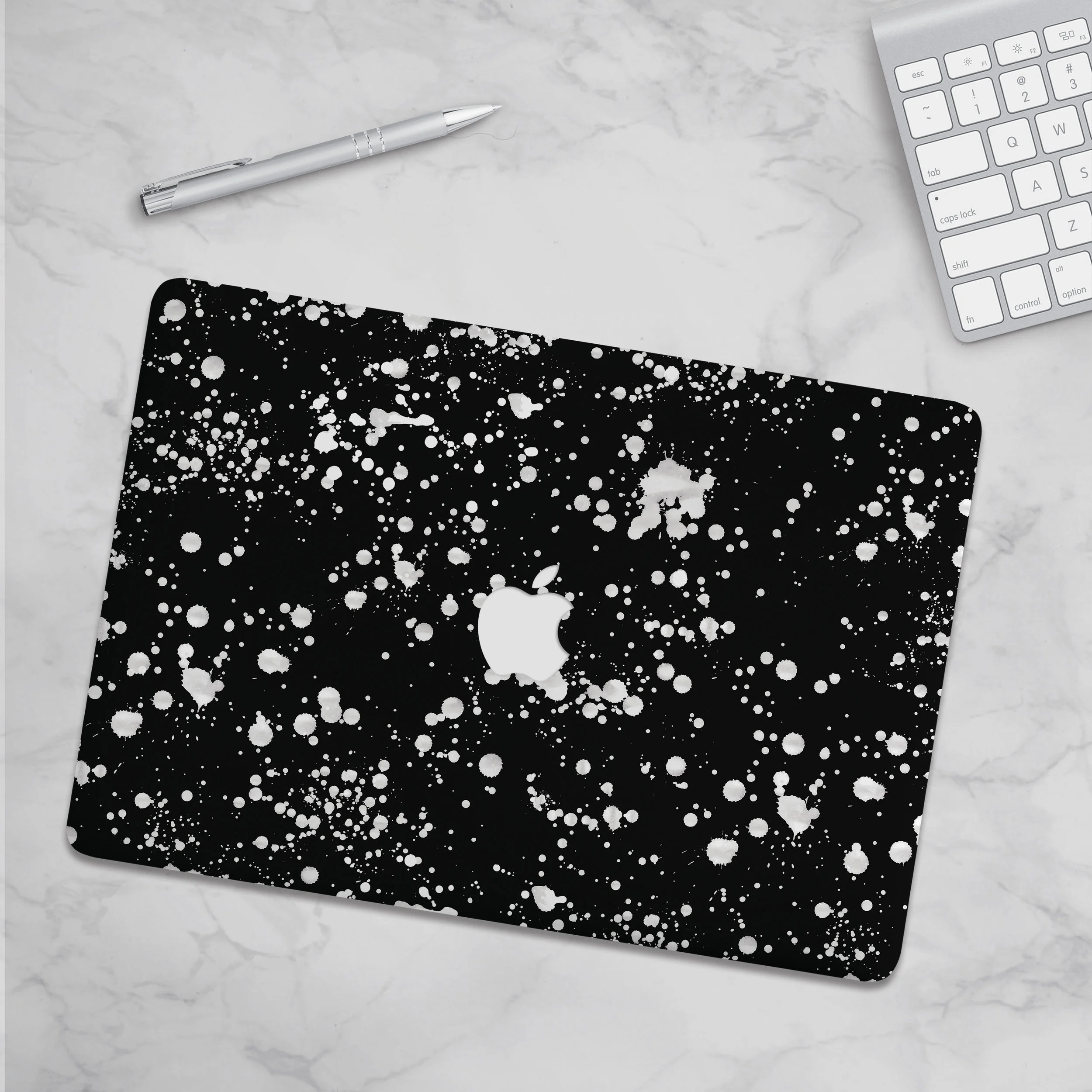 talkandtell_blackspat_macbookskin.jpg