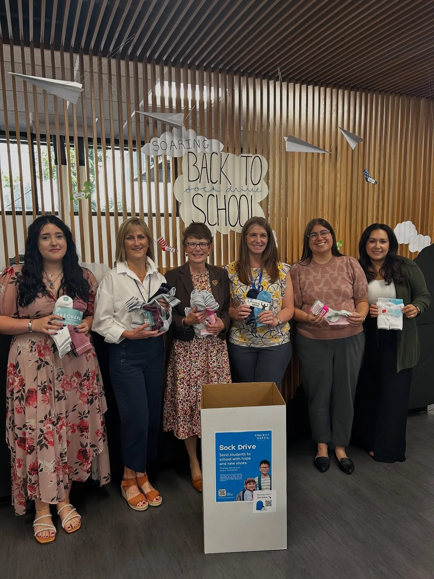 Giving back with joy ✨big thanks to @oregon_pacific_bank for collecting socks for Project Hope, and the super fun display!
