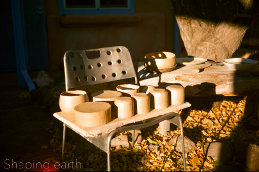 Shaping earth (Johnny speaking) We use primarily the magical micaceous clay found in most native cultures around New Mexico. The particular clay we use is from a pit that has been used by Taos Pueblo for a long time.