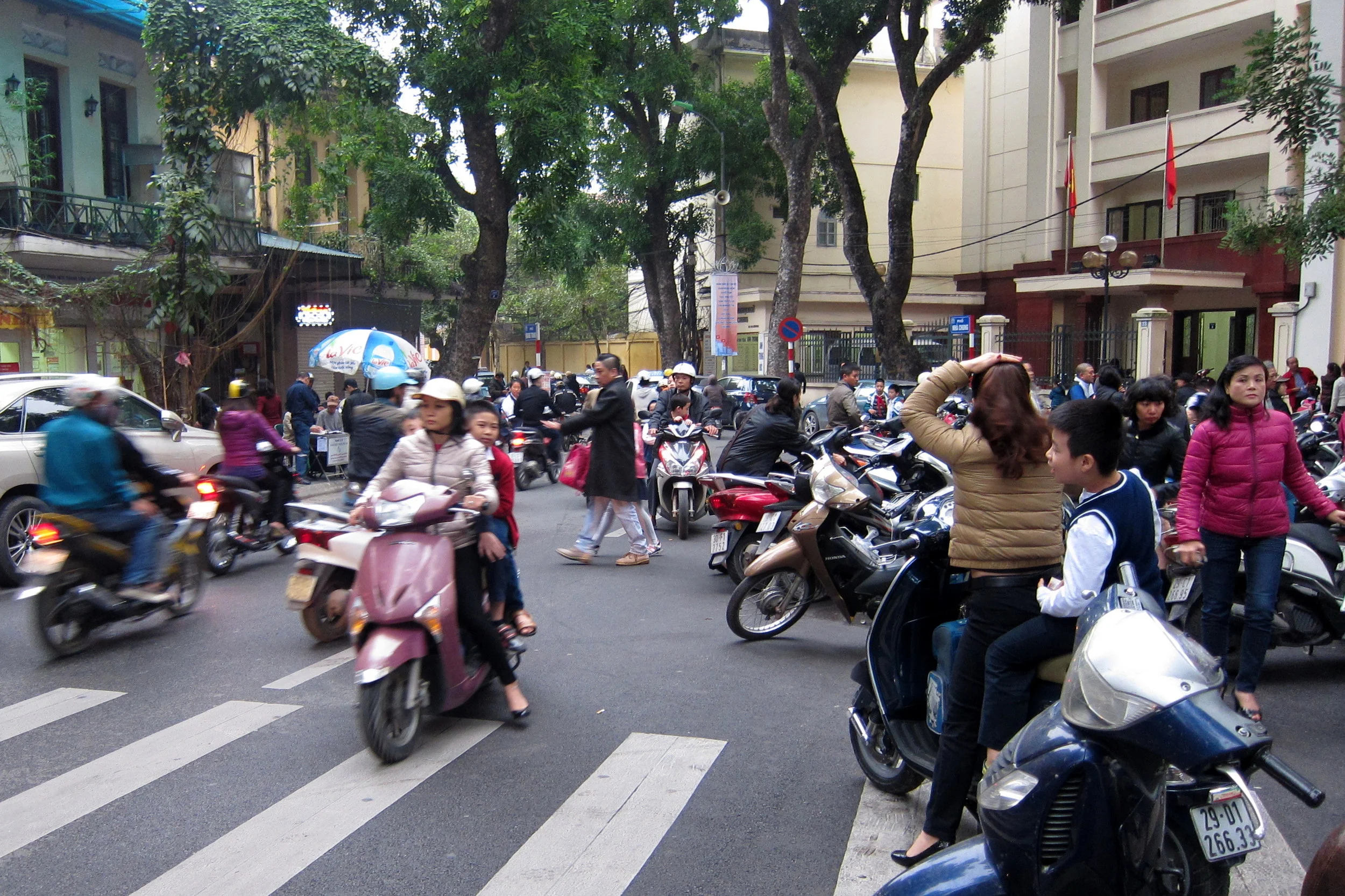  Everyone rides a motorbike in Hanoi. Here's elementary school pickup. 