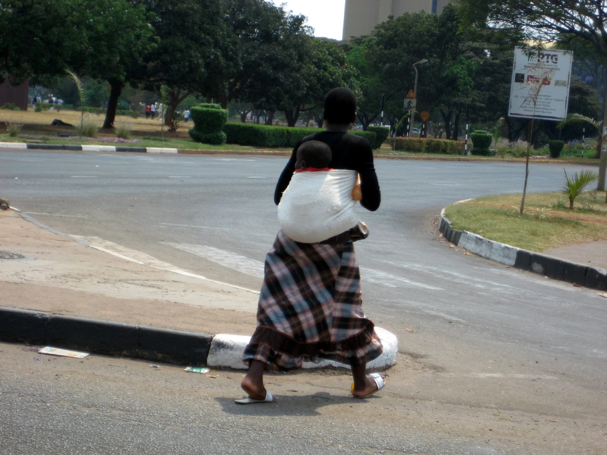  Zimbabwean mamas wrap their babies onto their backs. 