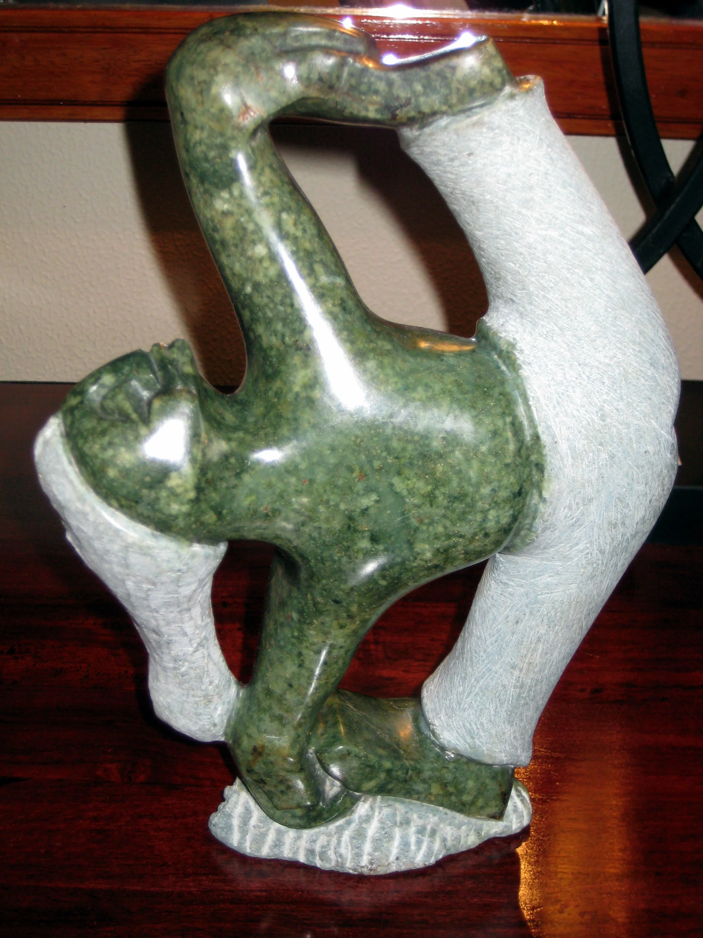  Zimbabwe is famous for skilled stone sculptors; here is a gymnast carved from lemon opal that I bought. 