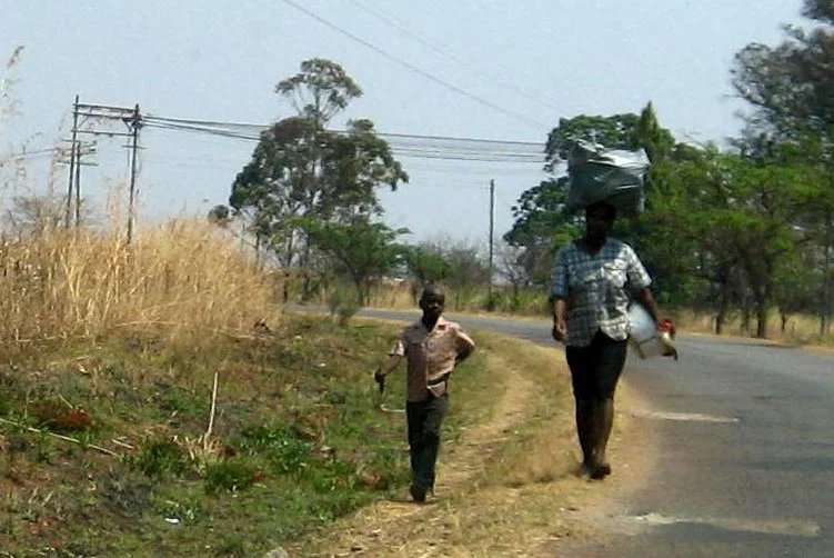 The women, in particular, are good at carrying bags, boxes,  etc. , on their heads without using their hands. 