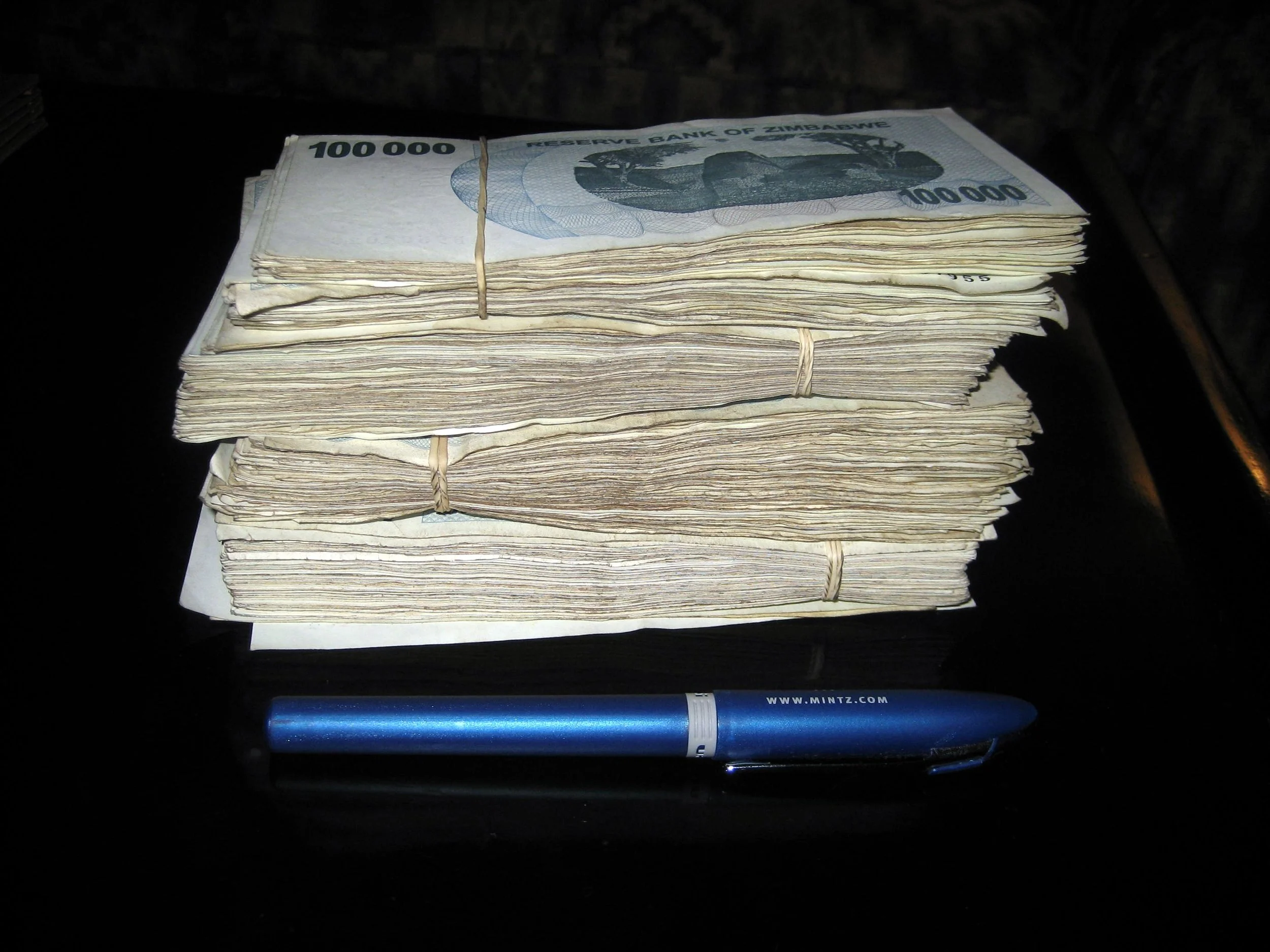  This stack of $100k Zim notes will buy a few dinners. It's crazy, you can't easily fit the money you need for a night out in your pocket. I'd have to buy some sort of man-purse. And when they bring the bill at a nice restaurant, they bring a basket 