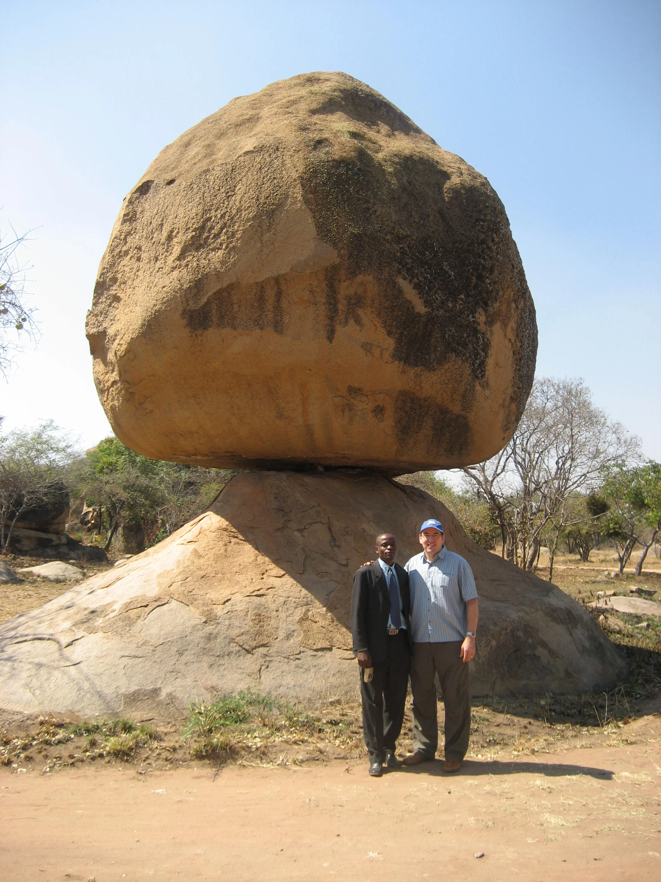  Here's Patrick and me at the “egg rock” in the Chiremba Balancing Rocks Park. These are remarkable natural structures formed by selective erosion. 