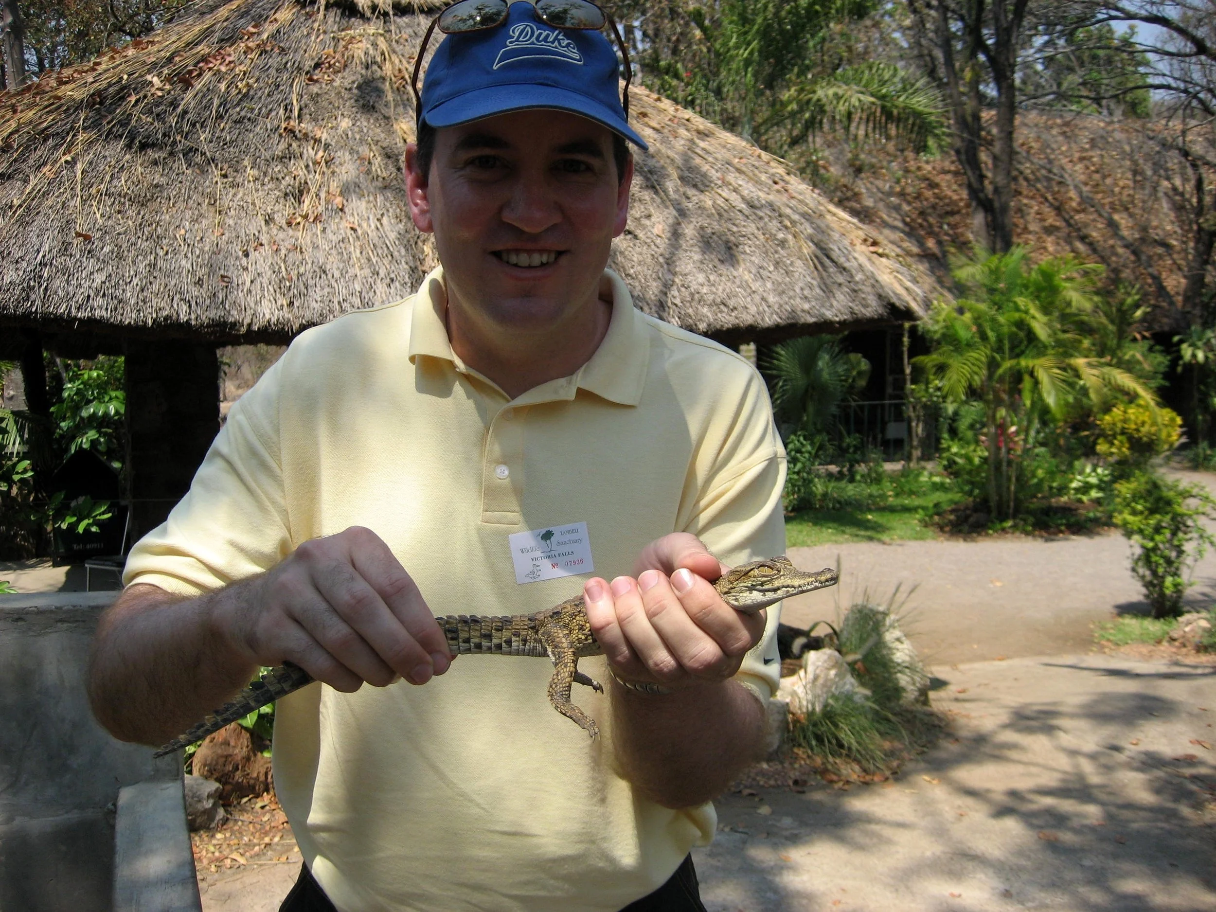  With a baby at a crocodile farm 