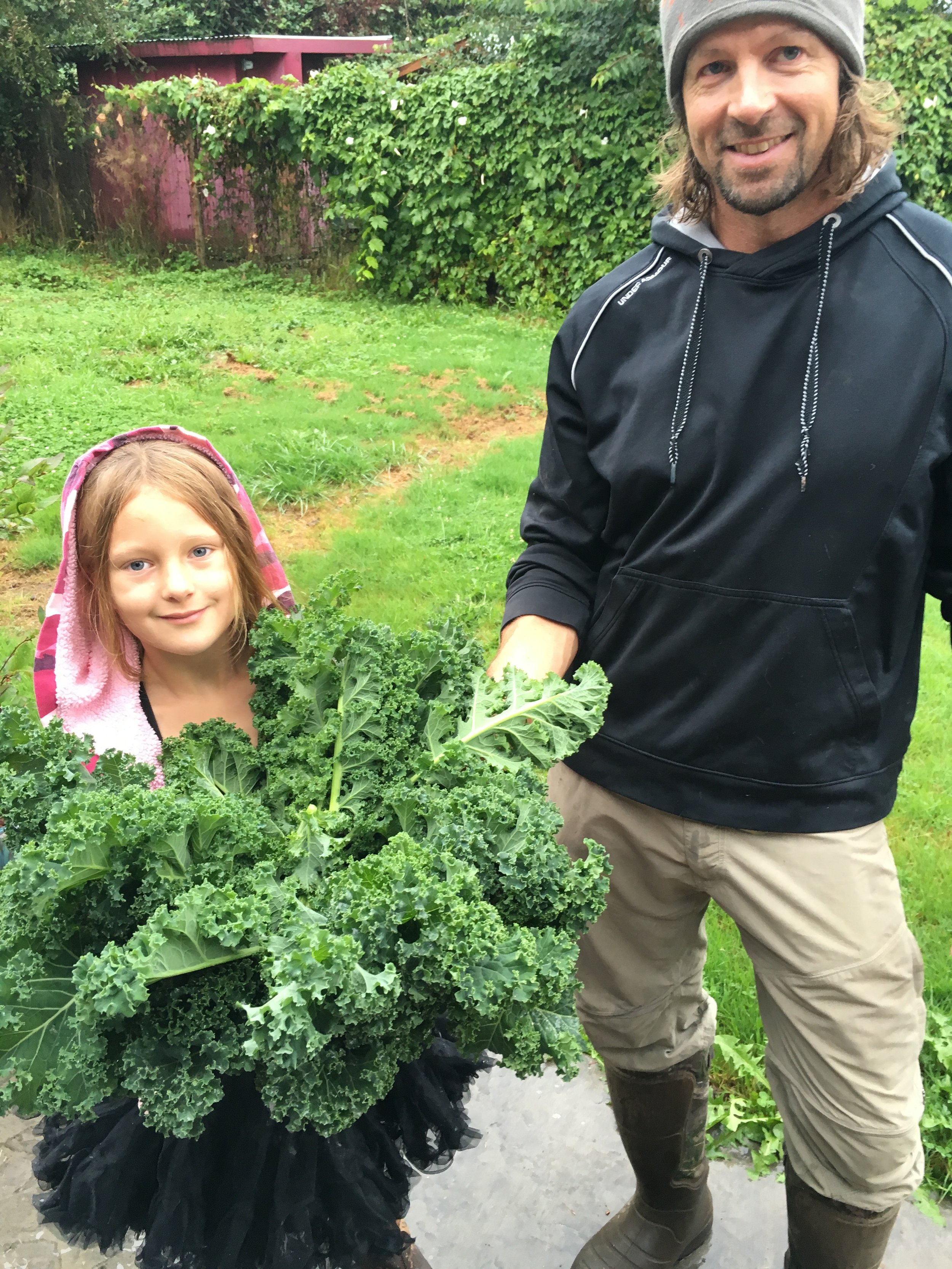 Ryan and Pailey after a kale harvest.&nbsp;