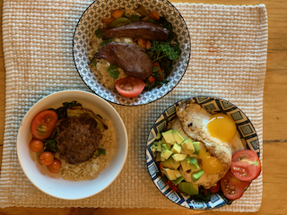 Food variation with elk burger, elk heart, and eggs.
