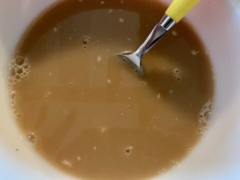 Mixing the warm coffee and cream of mushroom soup.