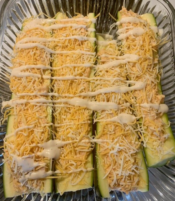 Topped with cheese and drizzled with ranch dressing.