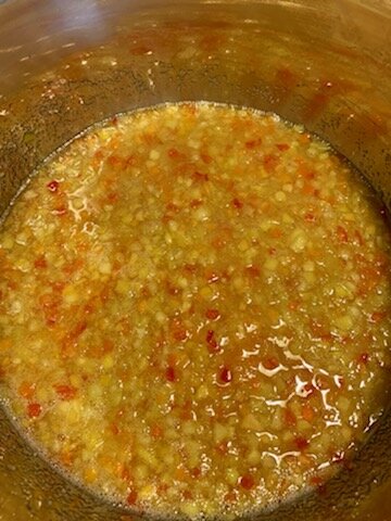 Jelly prepared in pot on stove.