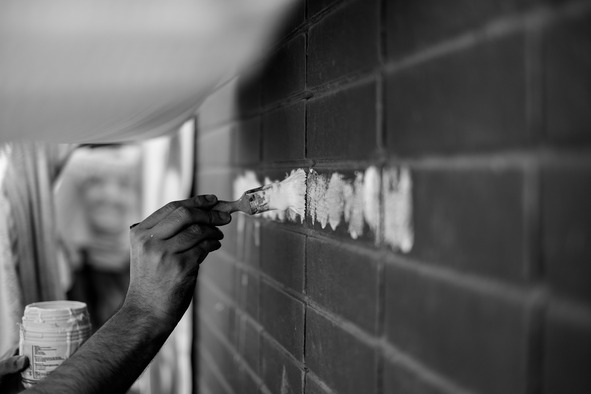 Representing identities and giving voice to others through pasting their photos on the walls... 