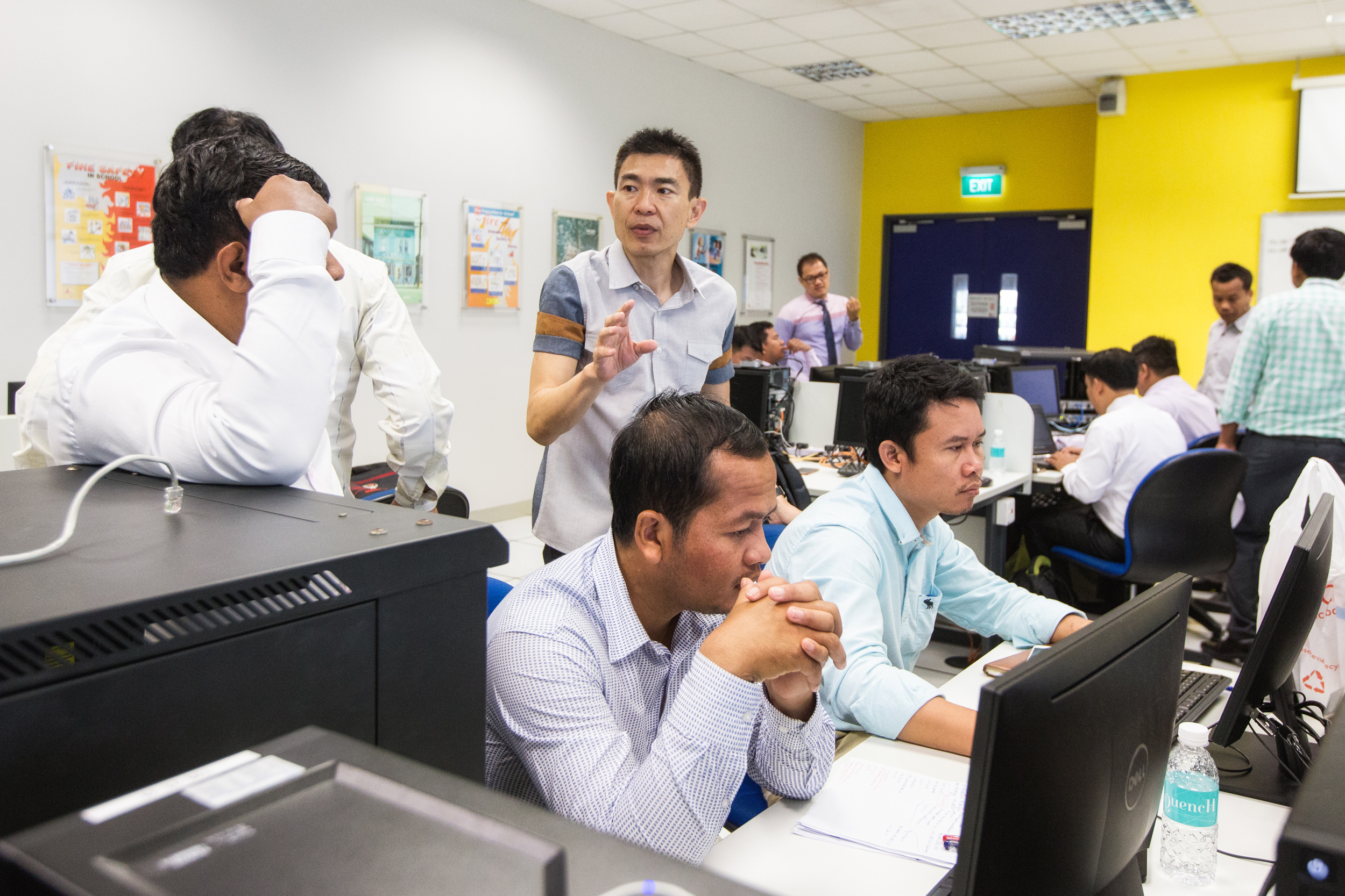  Desmond See (centre), 50, a senior lecturer from Singapore’s Institute of Technical Education (ITE) College East, explaining the steps involved in setting up, configuring and testing a small network. 