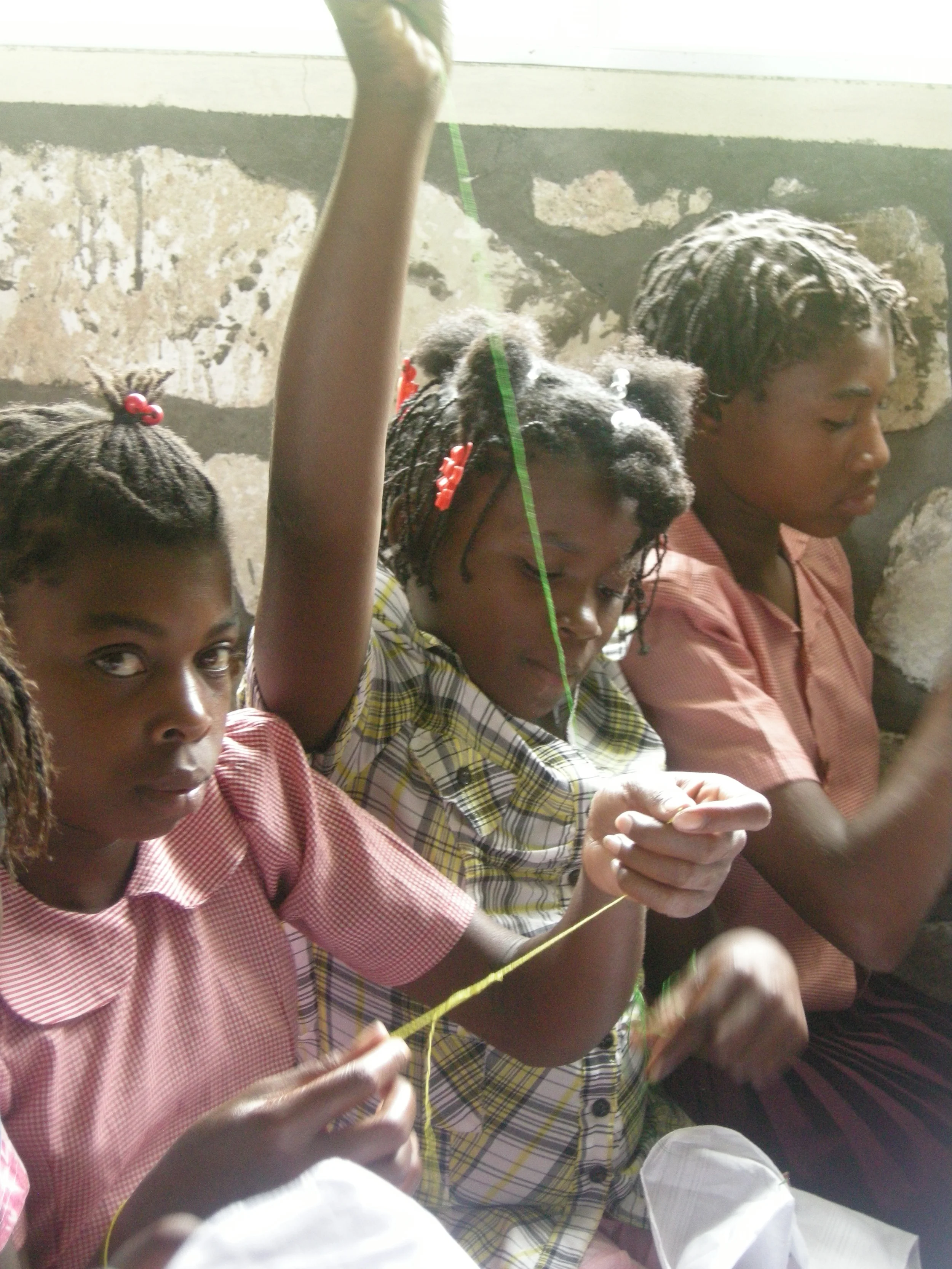 Girl with green thread embroidering