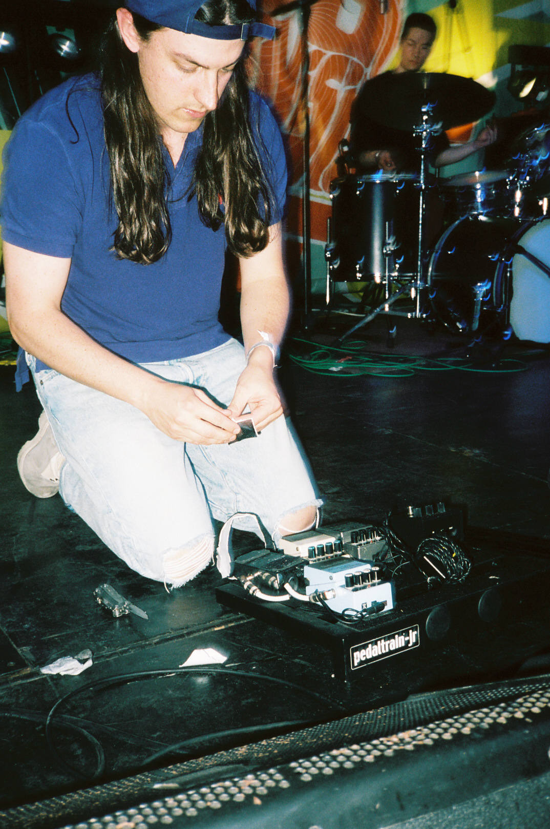 Tommy dialing in his guitar tone and setting up his pedalboard