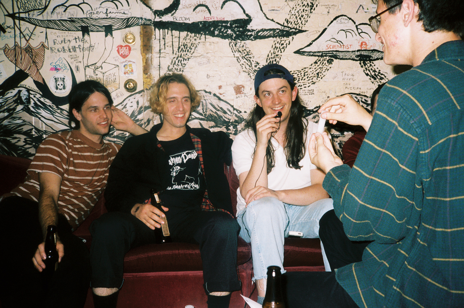 A photo of the group getting interviewed by a college indie radio station