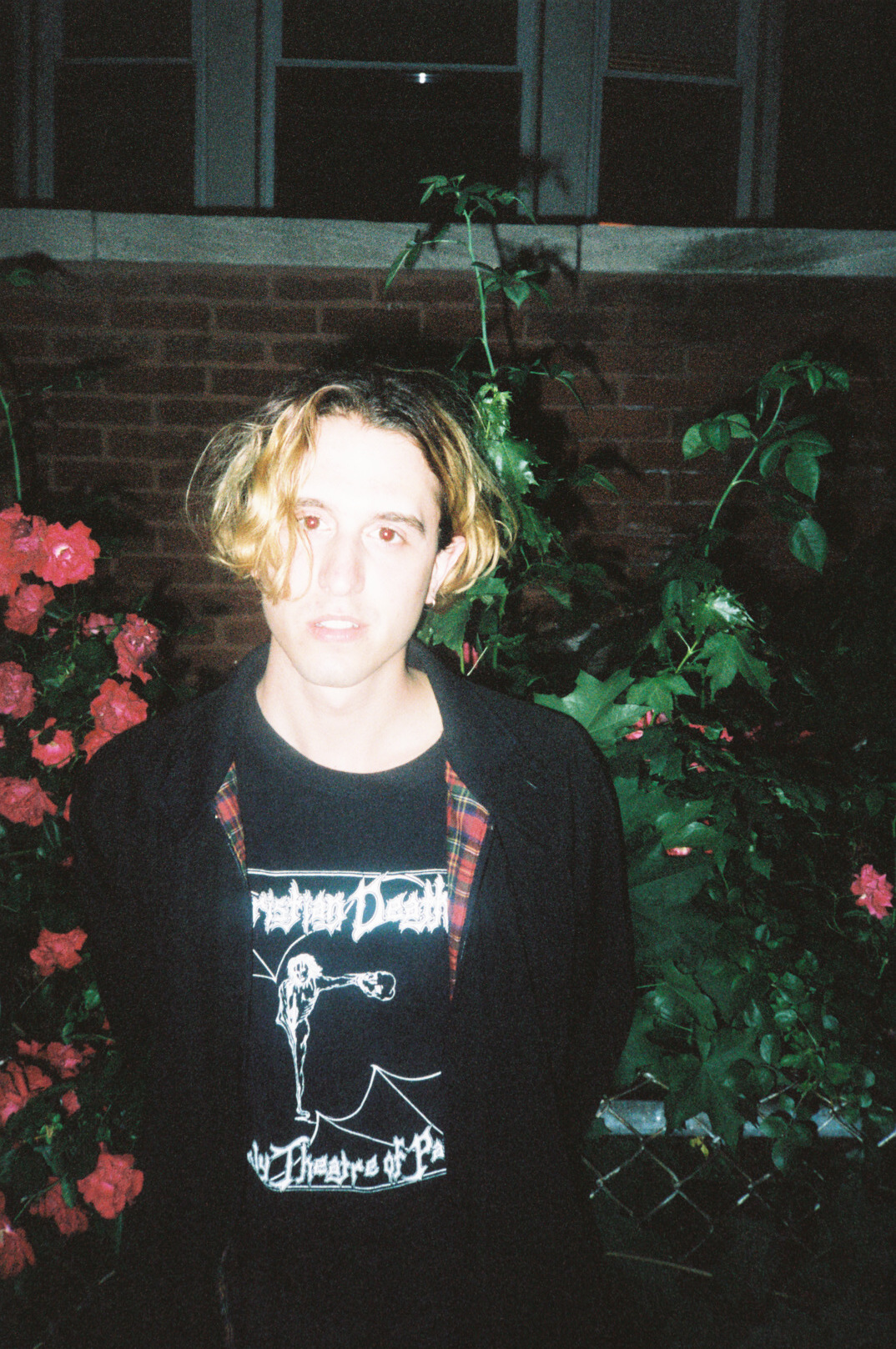 The weather was perfect for a summer Chicago night, Dustin wanted to walk around the neighborhood outside the Empty Bottle. I stopped him to take his portrait in front of a rose bush. A few girls yelled at us from a rooftop jokingly telling us to get away from their rose bush. I yelled back at them to let us on their roof. The girls then invited us on their rooftop and handed us a few beers as we watched the city turn from dawn to dusk.
