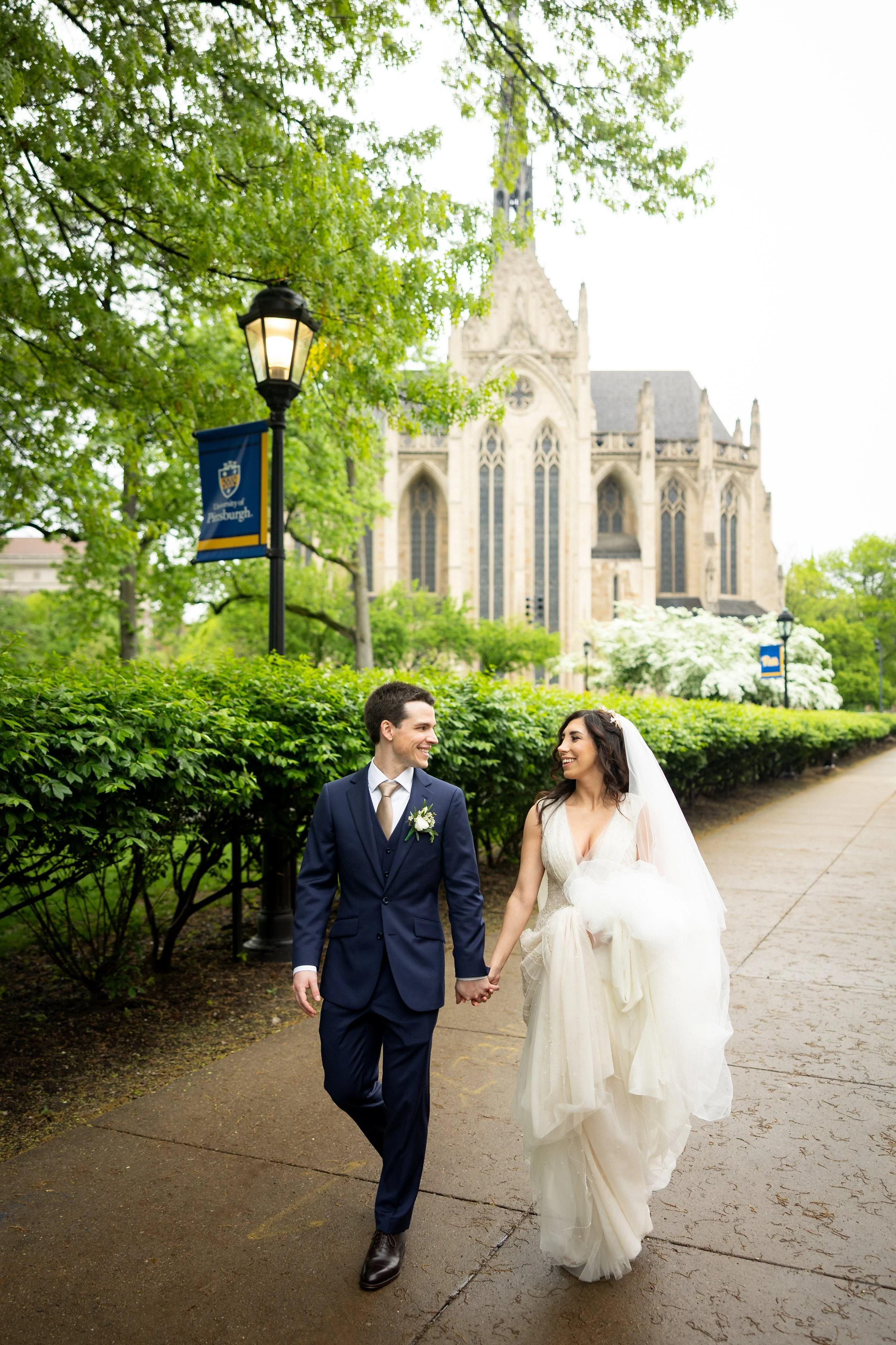 Photo of bride and groom walking in Oakland and happy at their wedding