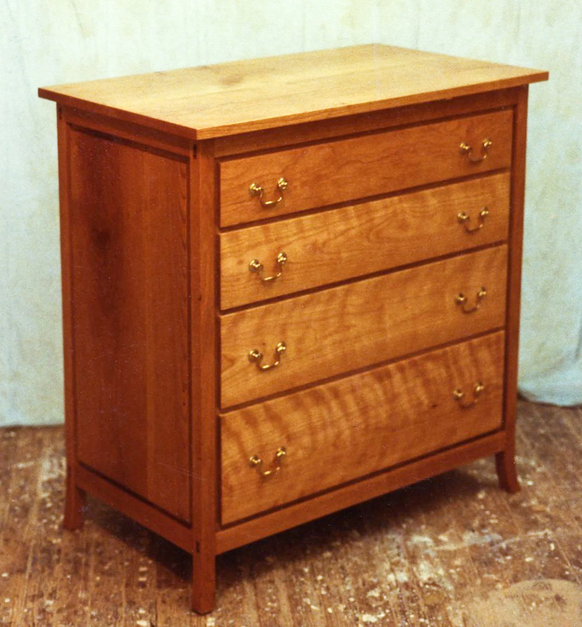 Cherry child's bureau with brass pulls