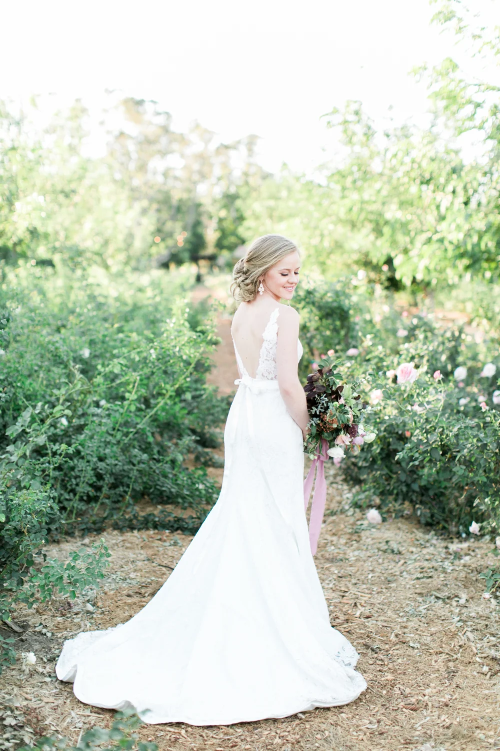 Bride gets ready for wedding photos at Walnut Grove in Moorpark, Ca.