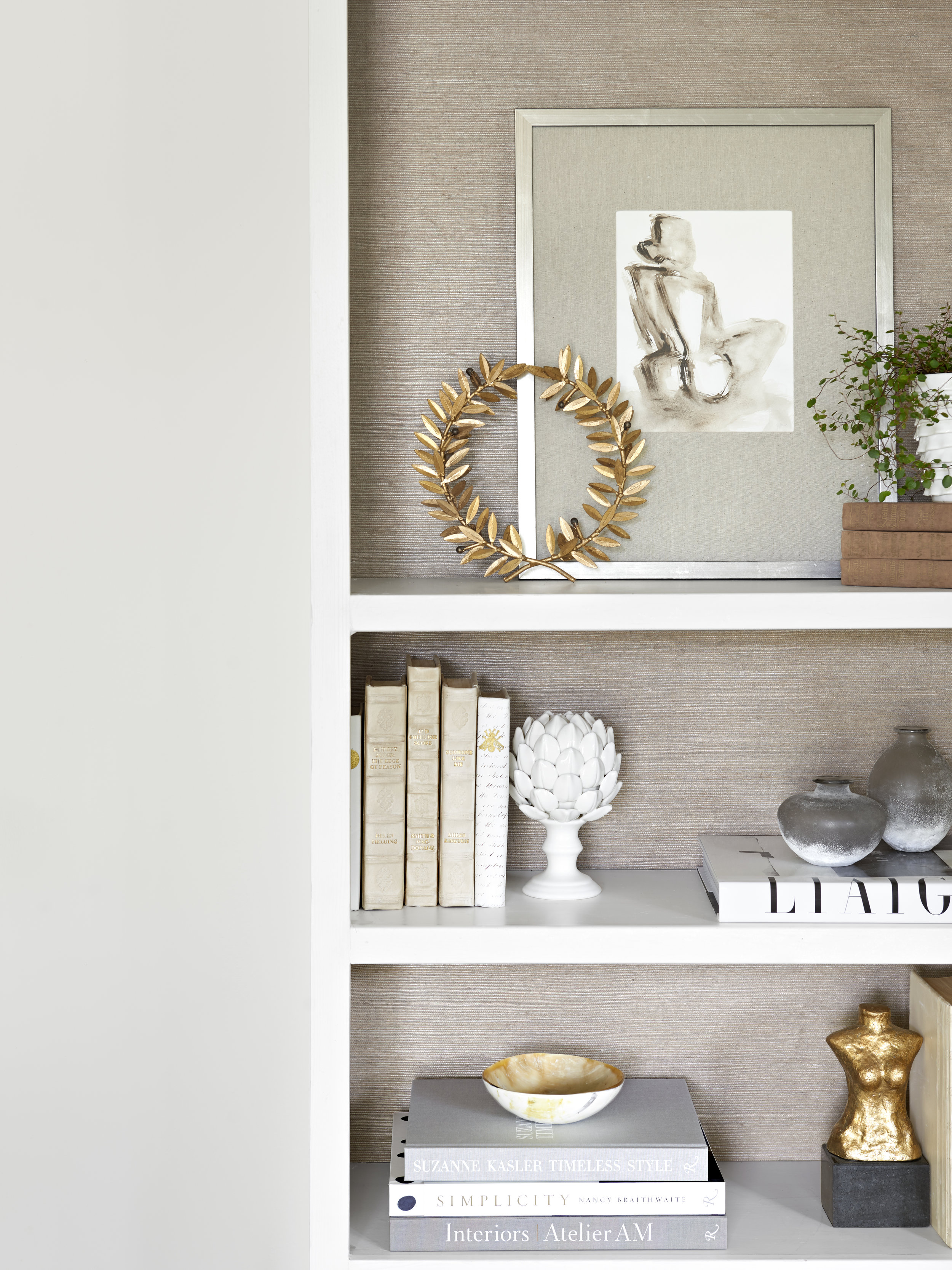 Bookshelf styling with art by Haley Matthews interior design by Charleston based interior designer Lindsey Davis