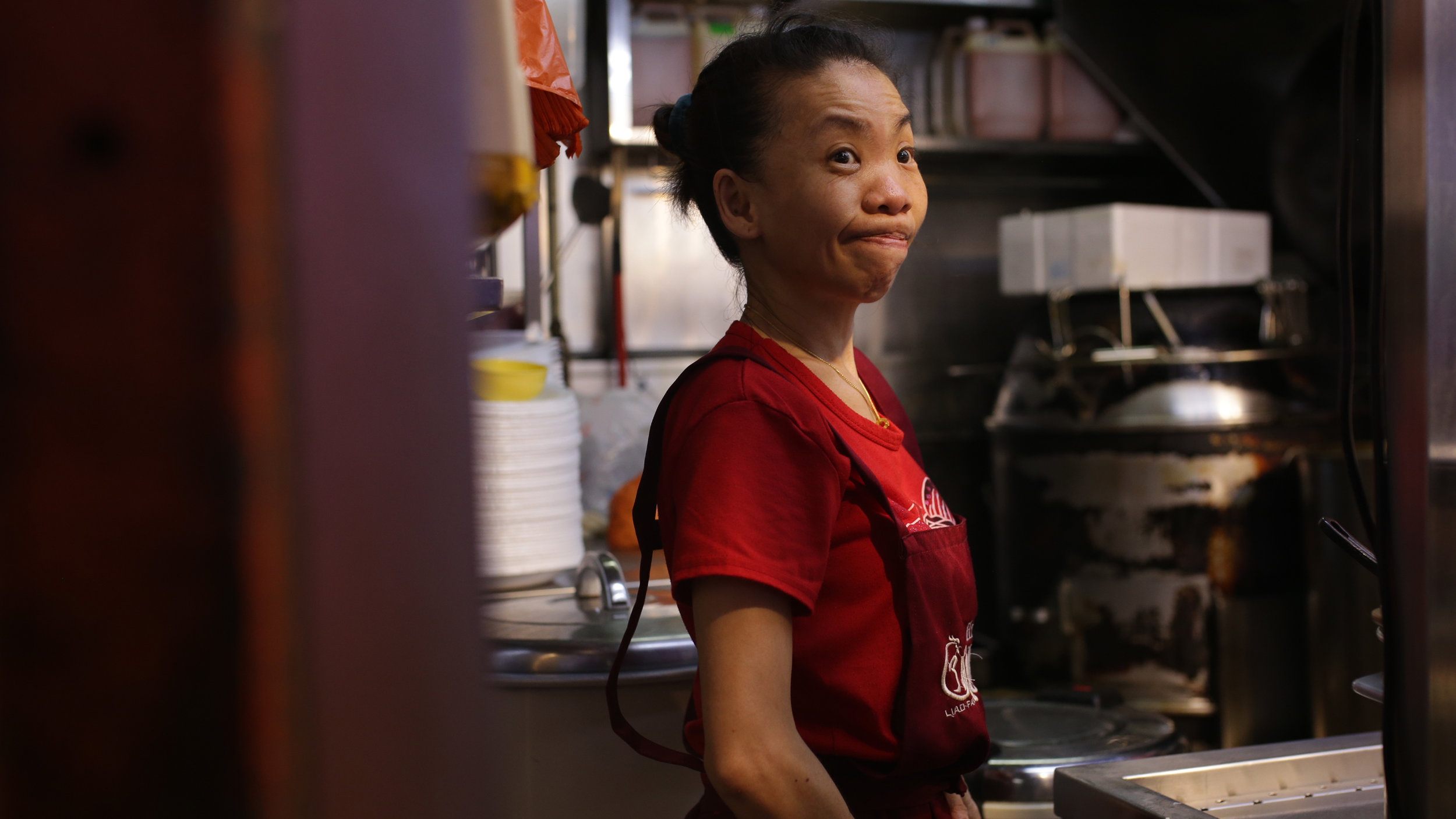  Chef Chan's wife mans his Michelin star hawker stall, Liao Fan. 