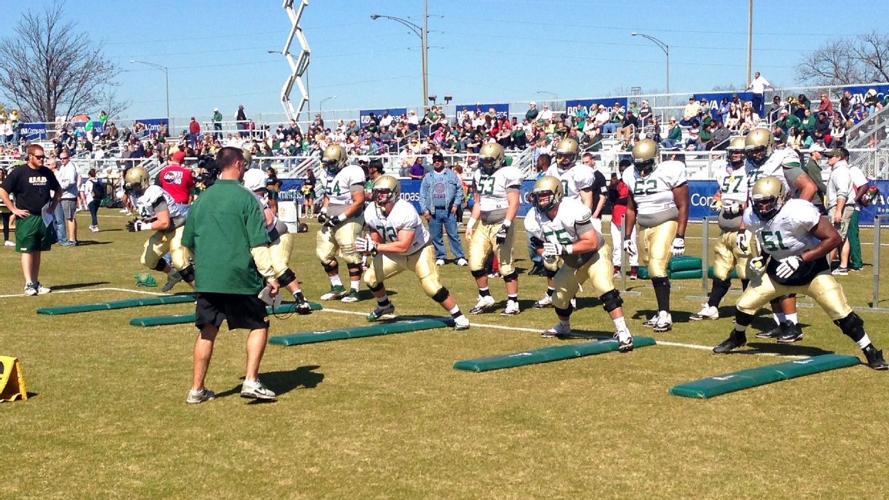 UAB's offensive line works out at its open practice in March 2016. I took this photo while on assignment for a story about the revival of the program, less than two years after the school's leadership shut it down. (ESPN)