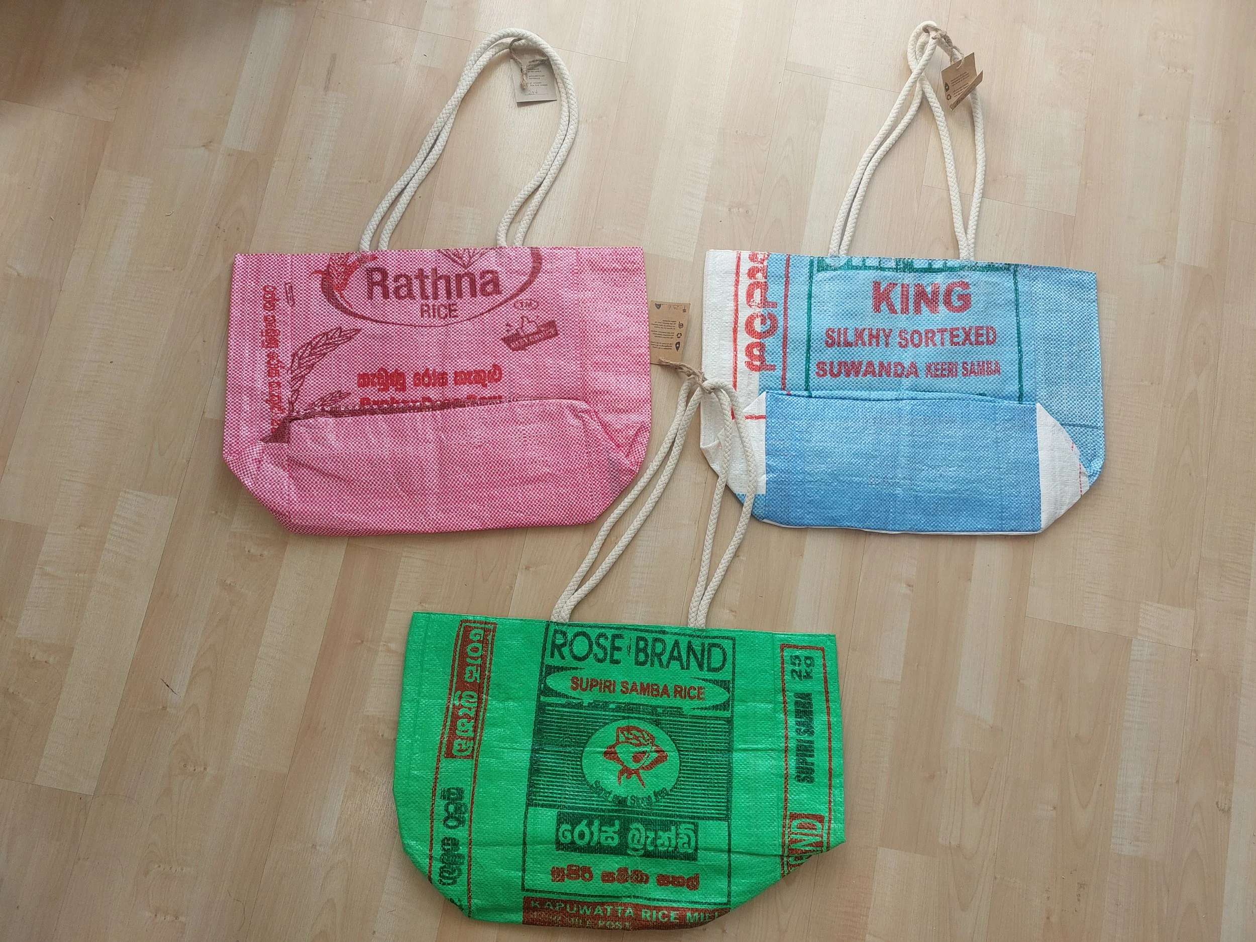 Three By One beach bags in pink, green & light blue