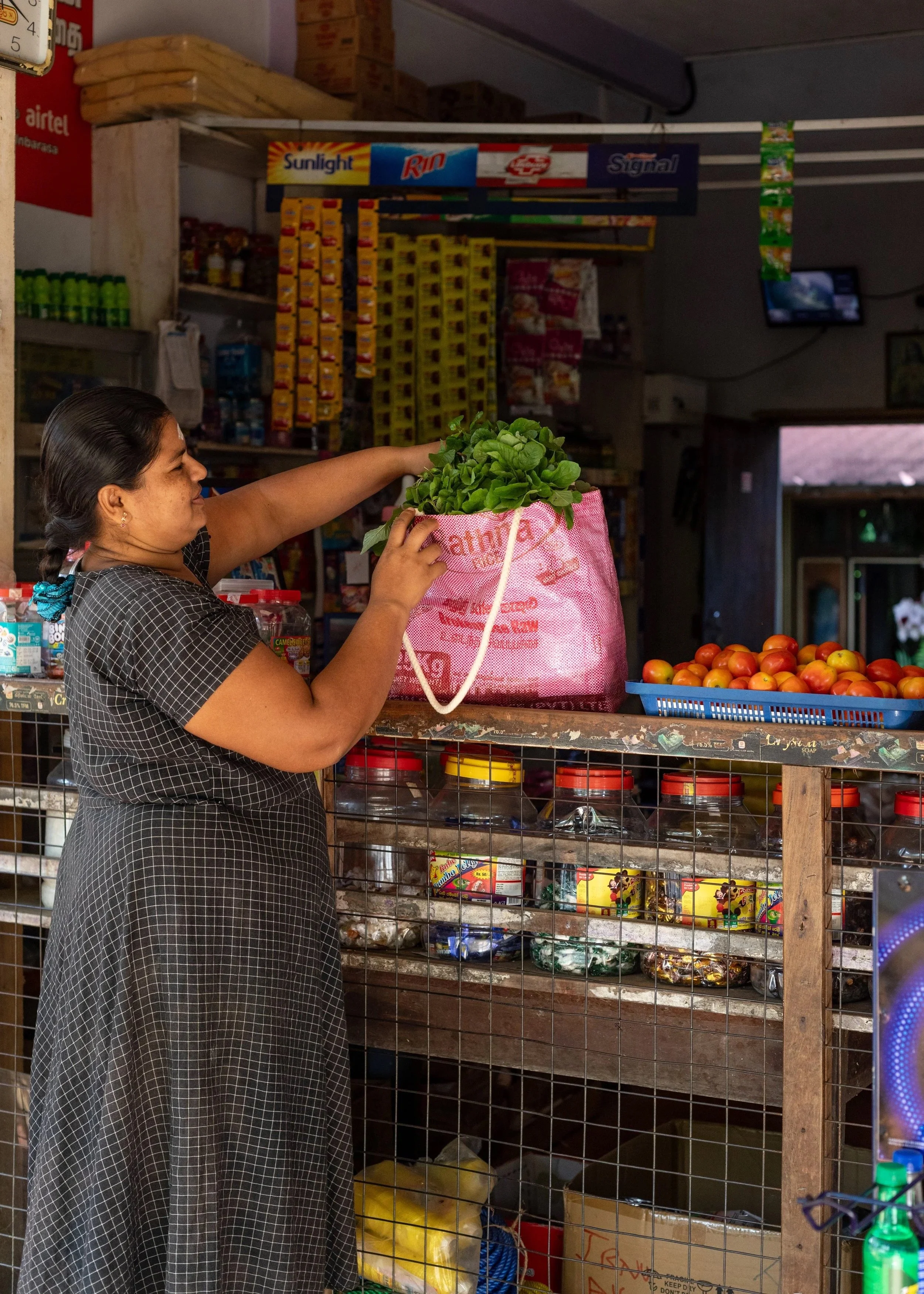 Woman at market with pink Three by One Beach Bag