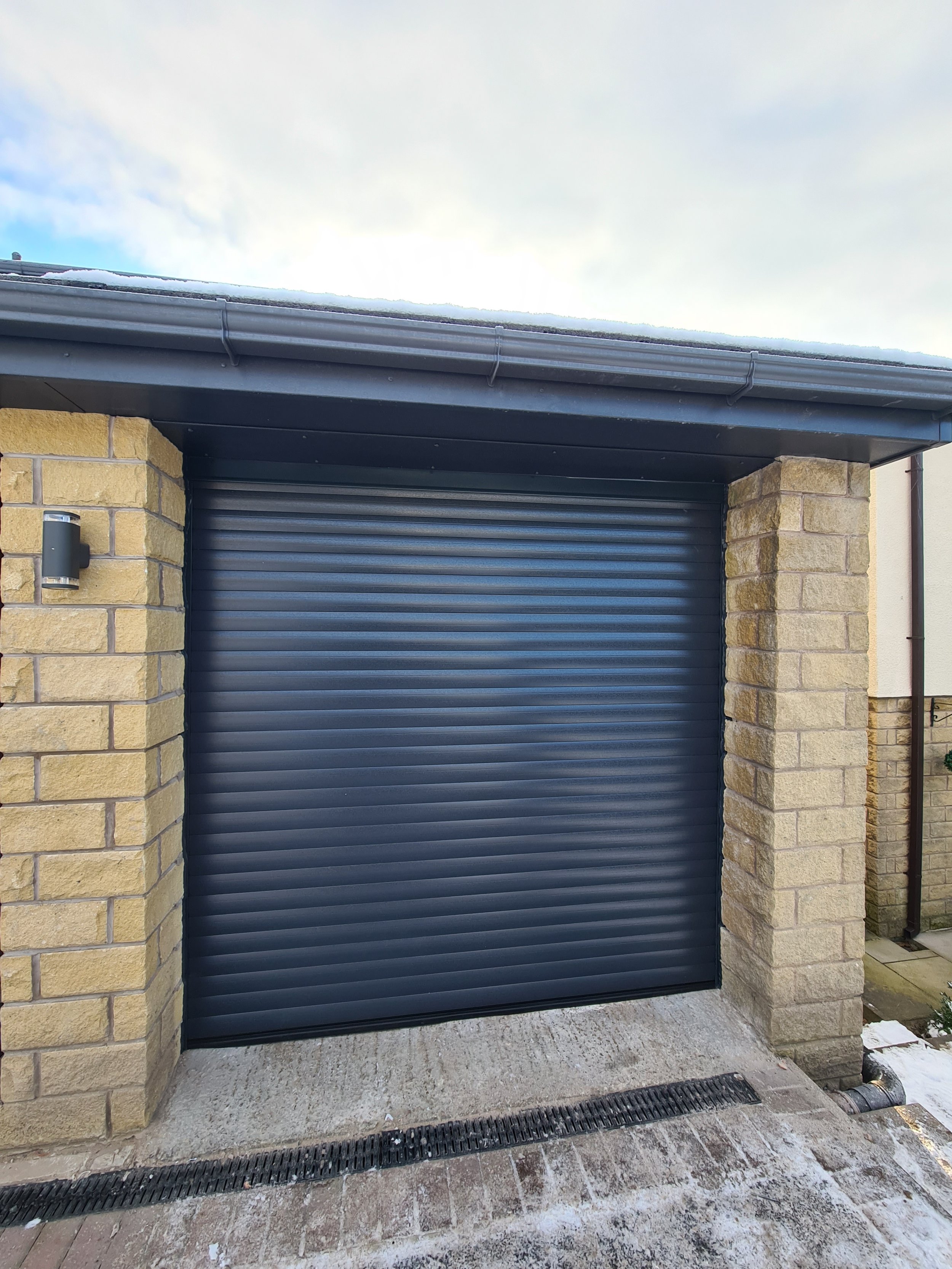Uk Doors Midlands Classic 77m fully insulated roller garage door in Textured Anthracite grey W/ matching frame