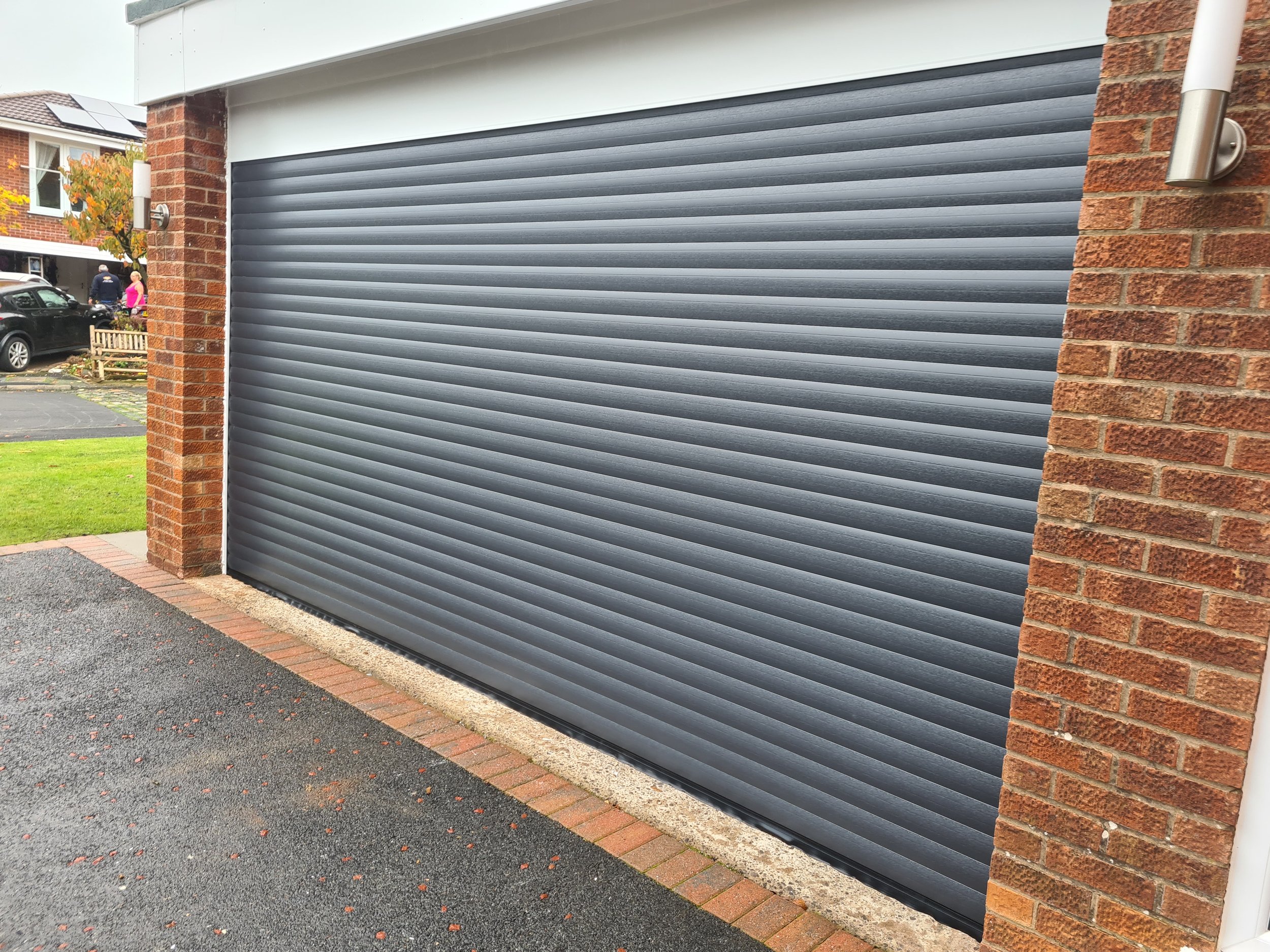 Uk Doors Midlands Classic 77m fully insulated roller garage door in Textured Anthracite grey W/ white frame