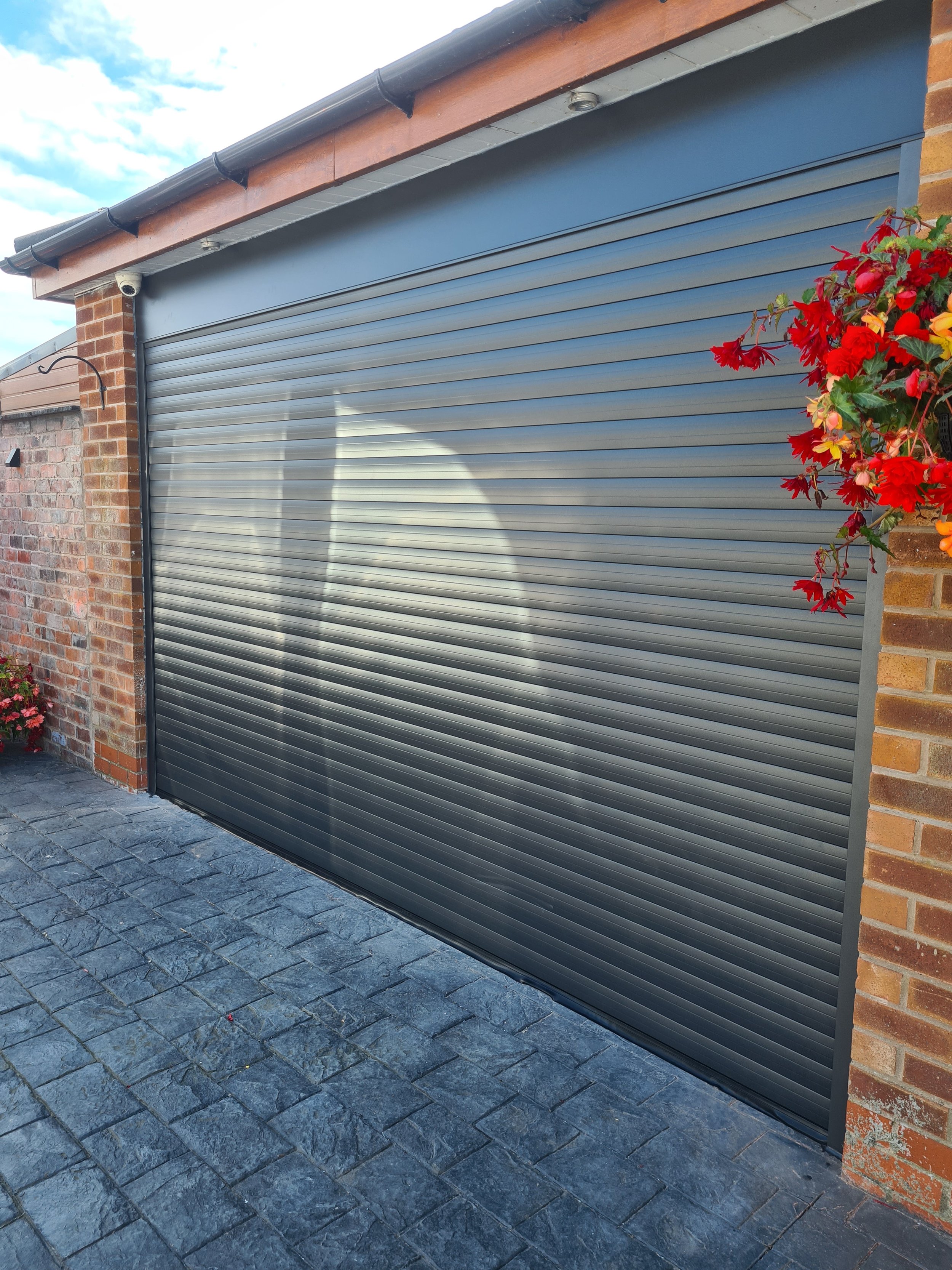 Uk Doors Midlands Classic 77m fully insulated roller garage door in Textured graphite W/ matching frame