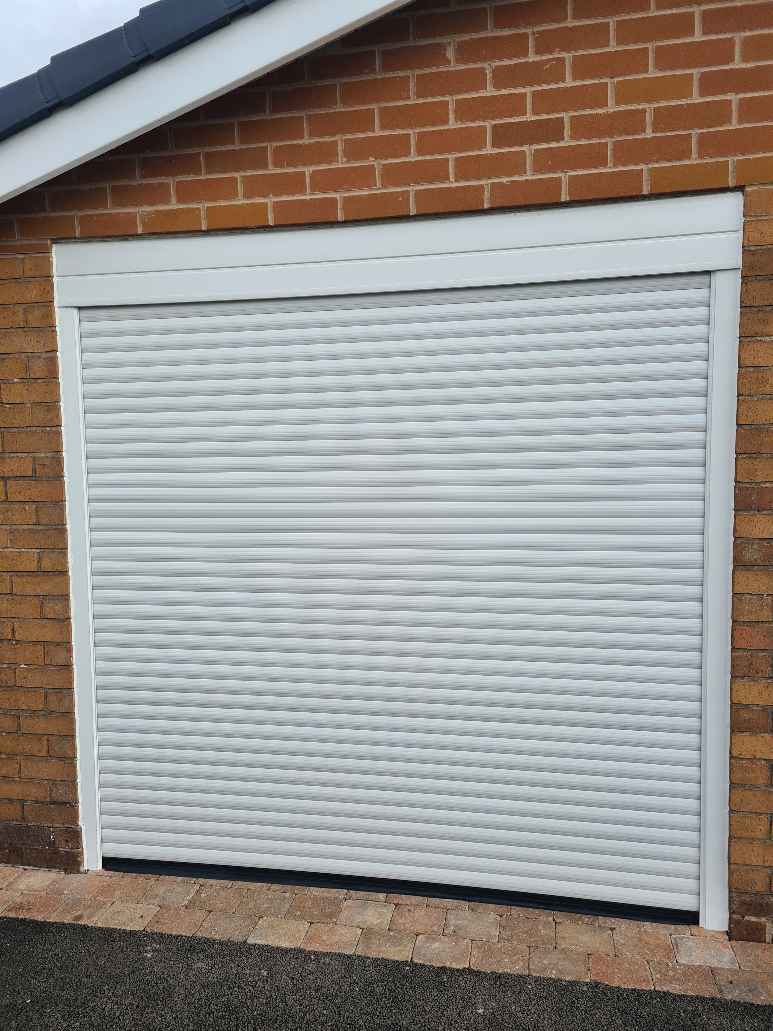 Uk Doors Midlands Classic 77m fully insulated roller garage door in smooth White W/ matching frame