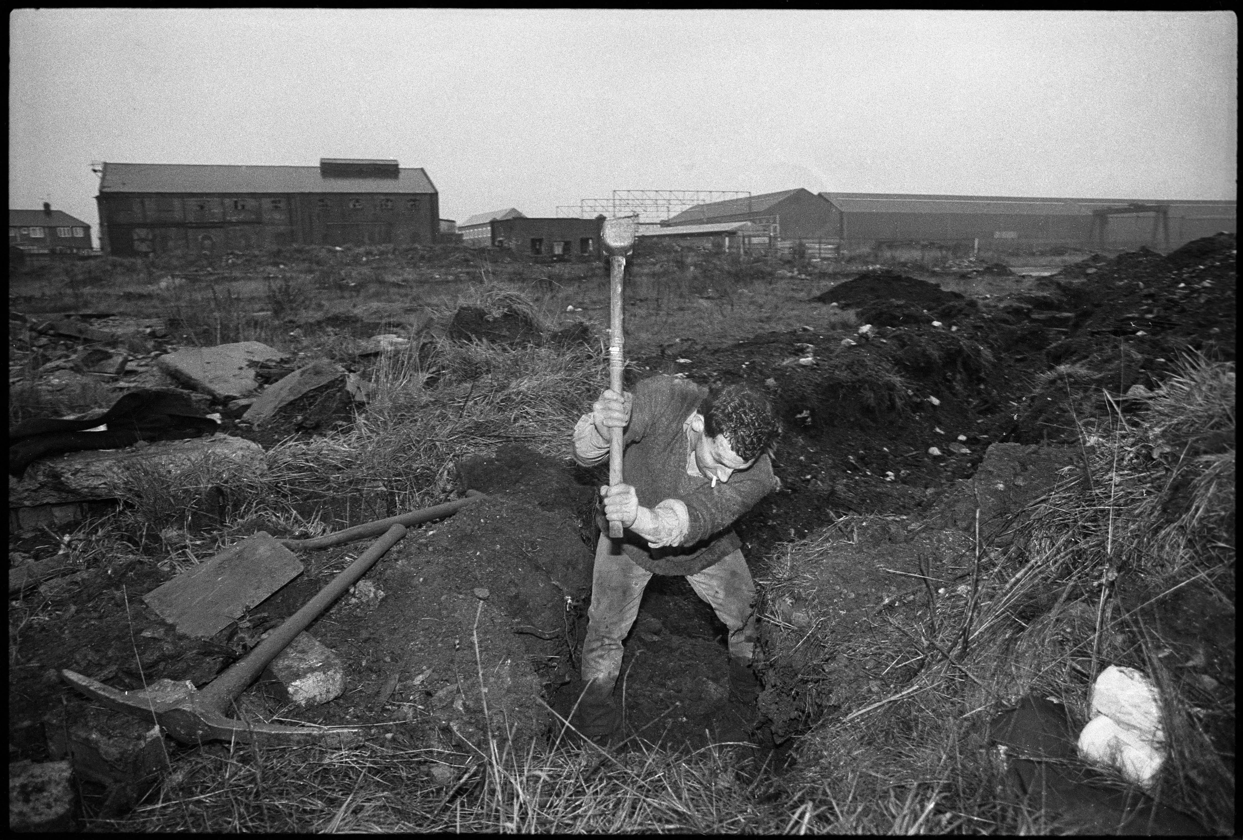 Unemployed man digging for scrap on toxic industrial land, Stockton On Tees, July 1986