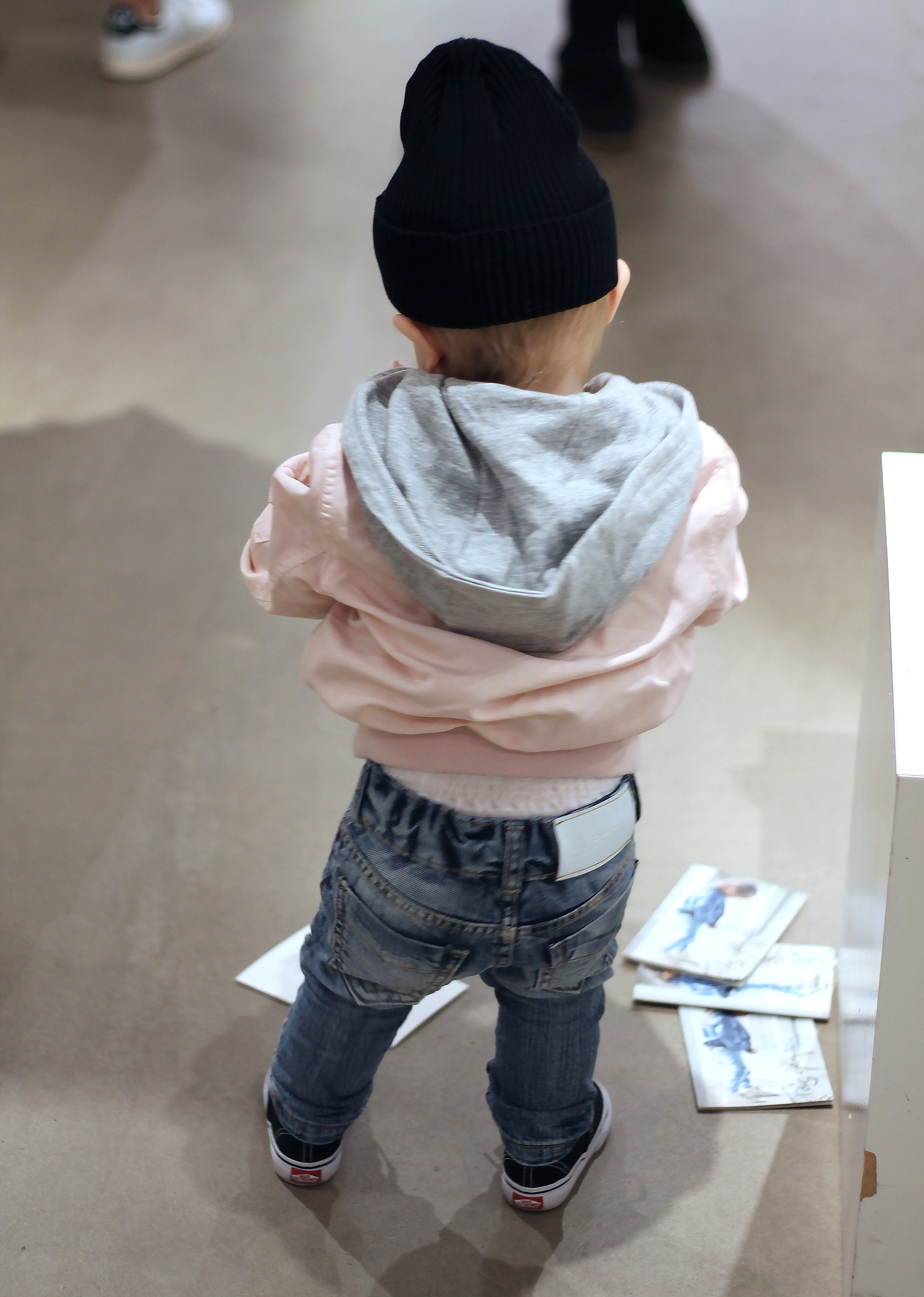 The youngest guest at the event, going through the flyers like a real pro.