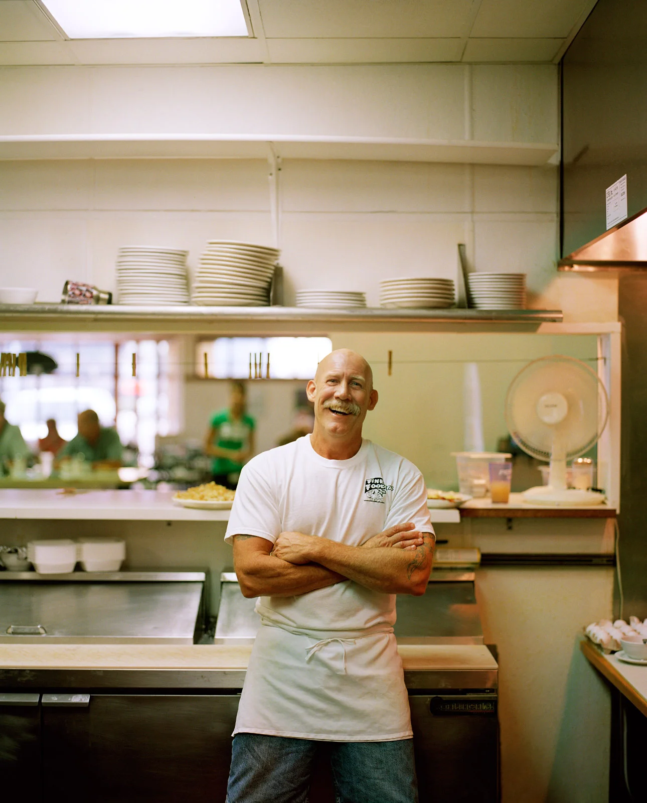 portrait of cook in the kitchen of a restaurant