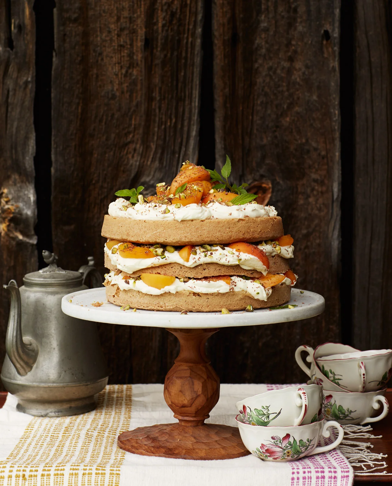Apricot tier cake at backyard dinner party