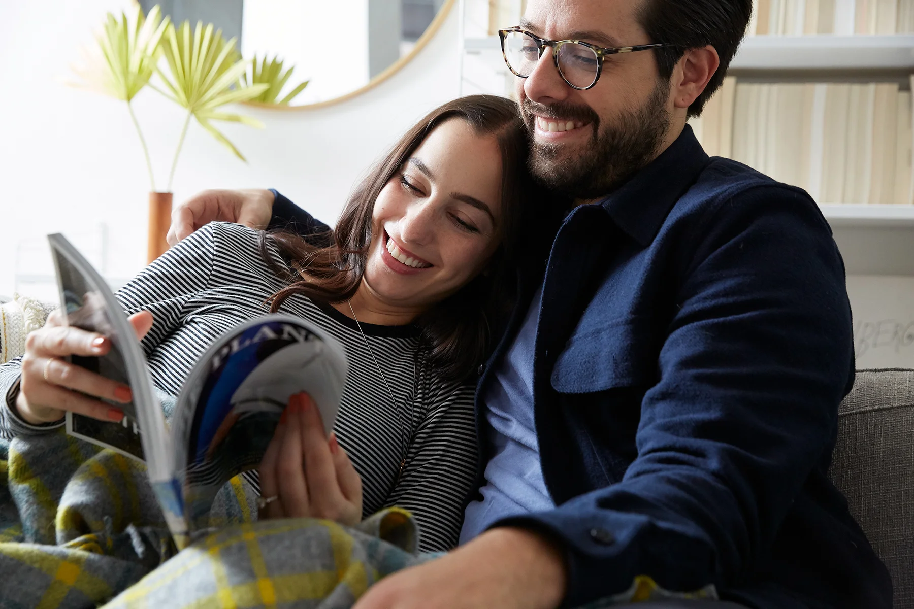 Couple reading together at home