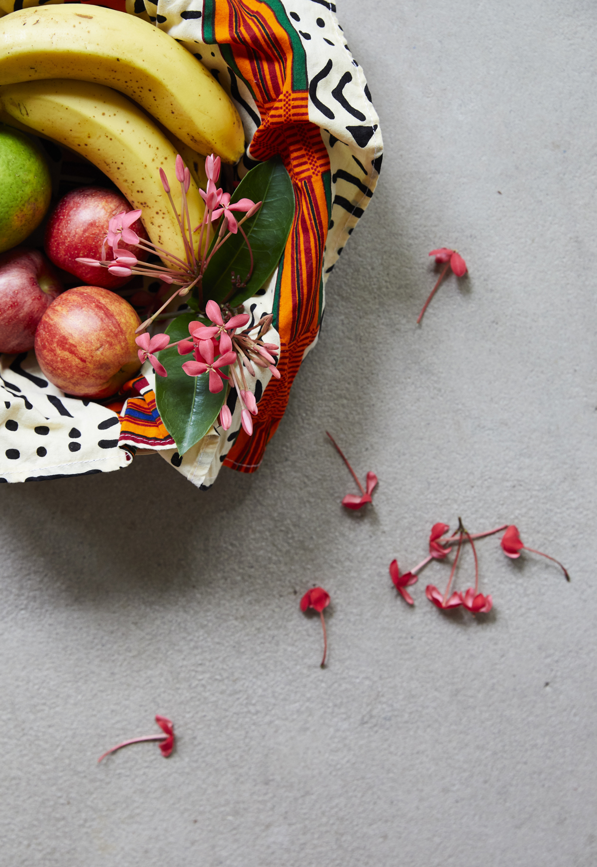 Bowl of fruit with flower petals
