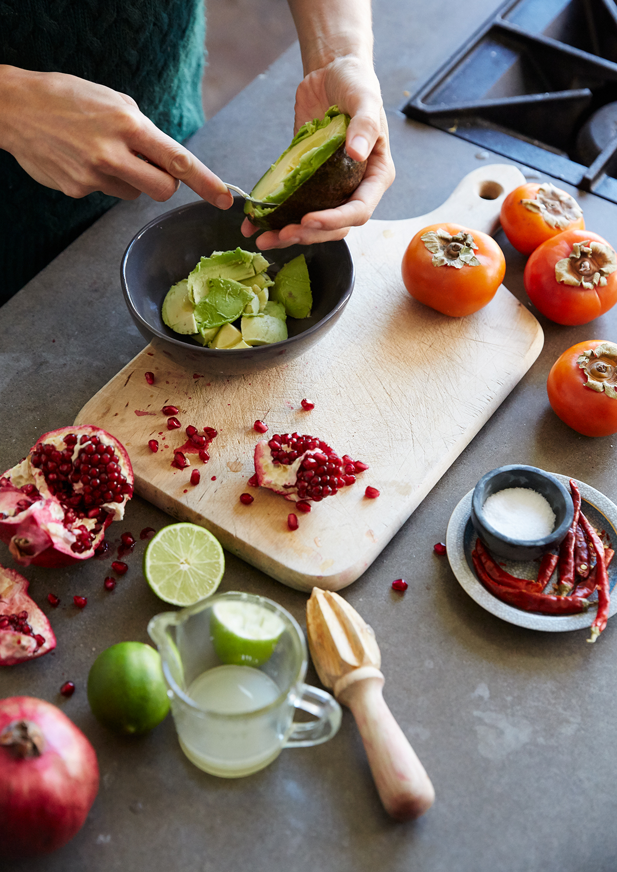 Woman scooping avocado