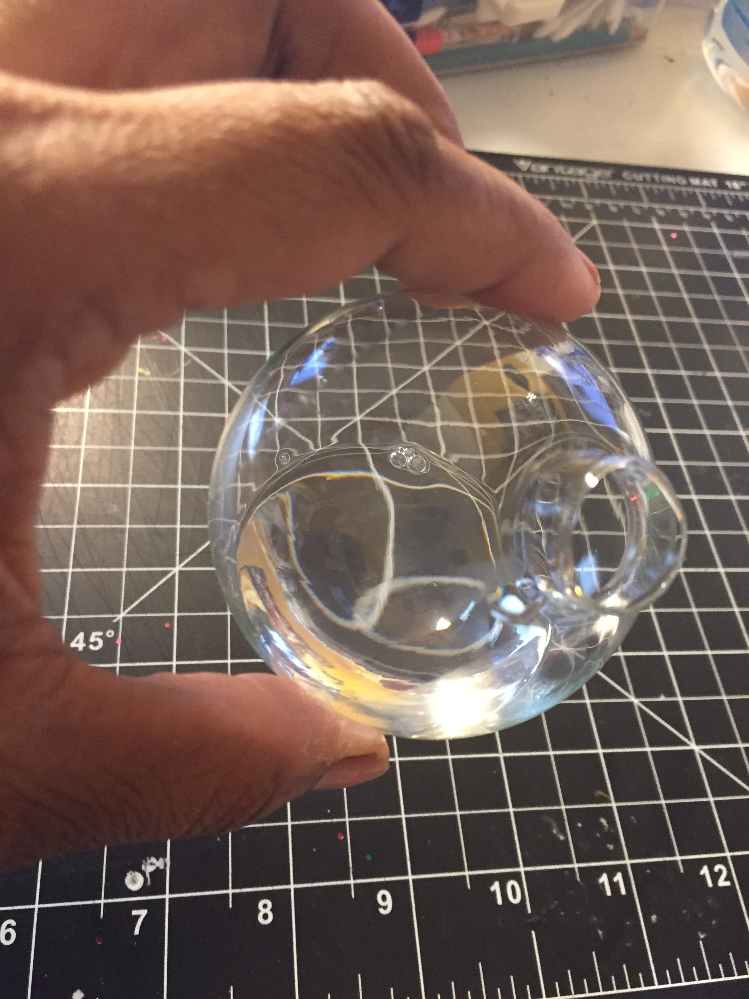 Go ahead and swirl it around. Cover the open cover with a rag and turn it upside down. Careful not to shake it though. Shaking will cause bubbles to form and you don't want that.